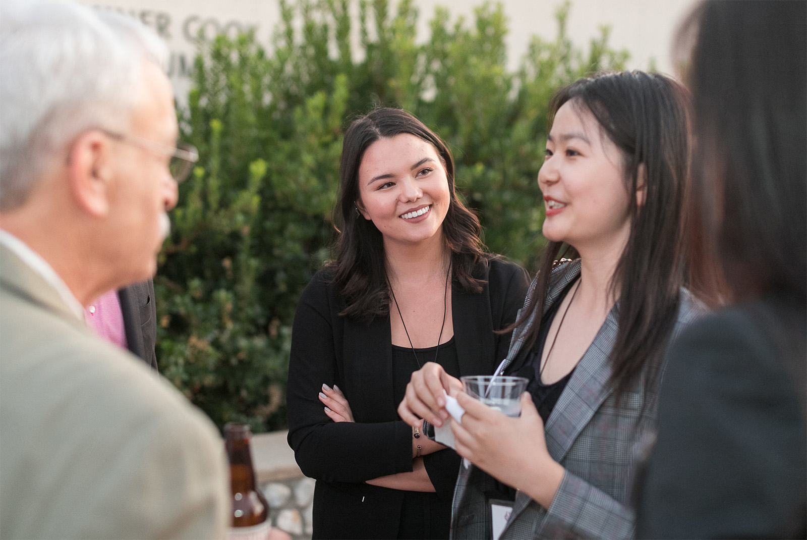 Alumni having a discussion during an event.
