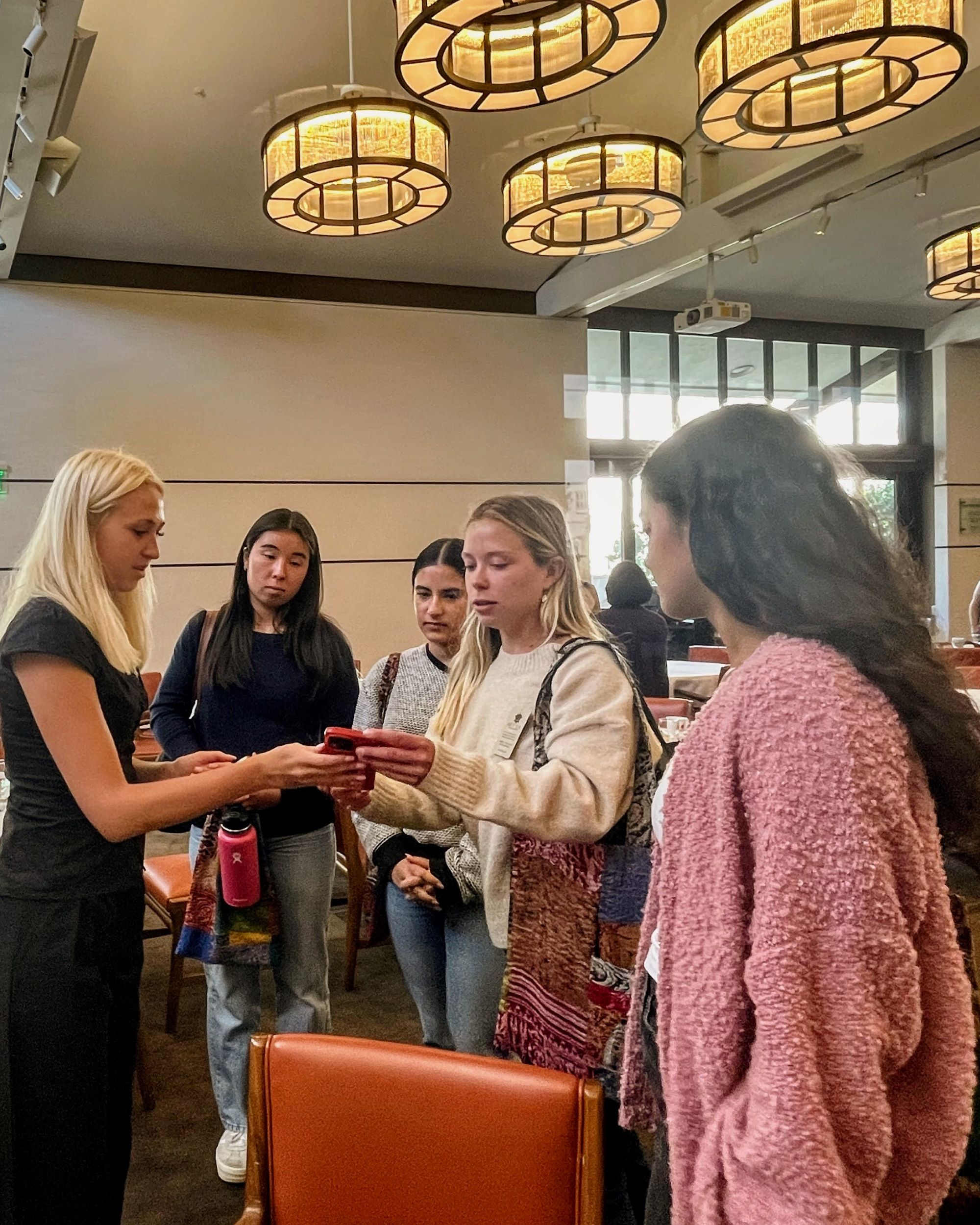 Photo of Izzy Murphy with CMC students