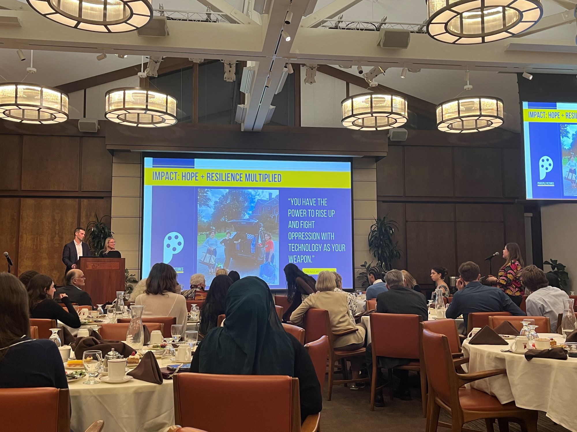 Photo displays Athenaeum dinner with speakers Beth Murphy and William Menard