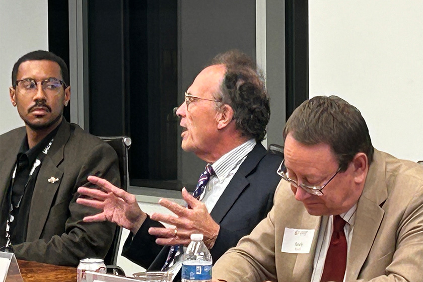 Moderator Matthew Glassman (left) and Professor Jack Pitney (center) on panel.