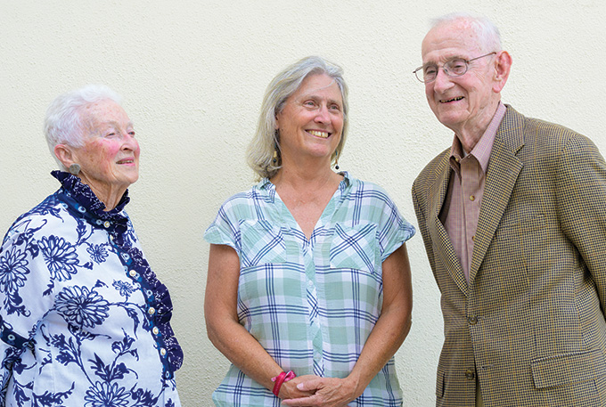 The Starks and Kathleen Hurley (center) recreating a photo from her arrival to college.