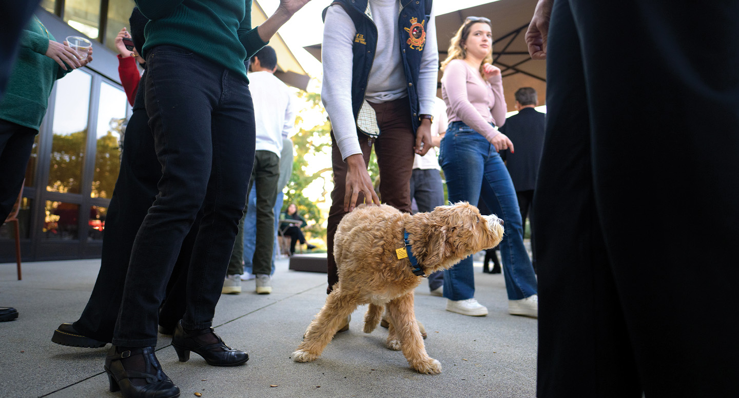 Theo among students at the first Ath tea of the Spring 2024 semester.