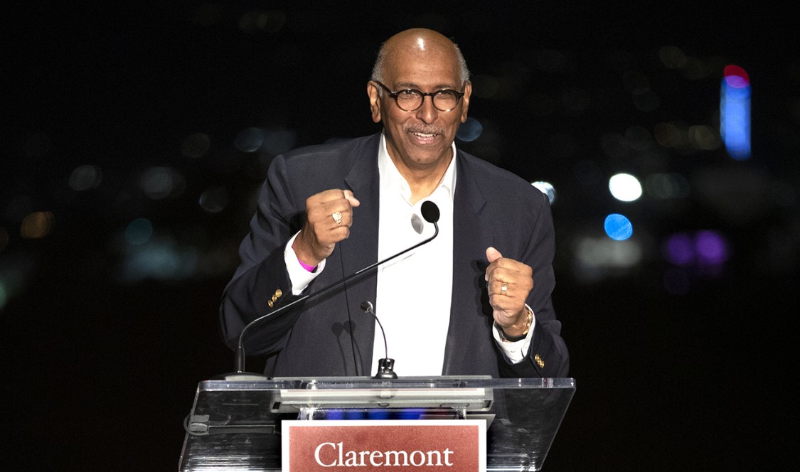 Michael Steele clenches his fists at the podium as he addresses the Res Publica Society dinner audience.