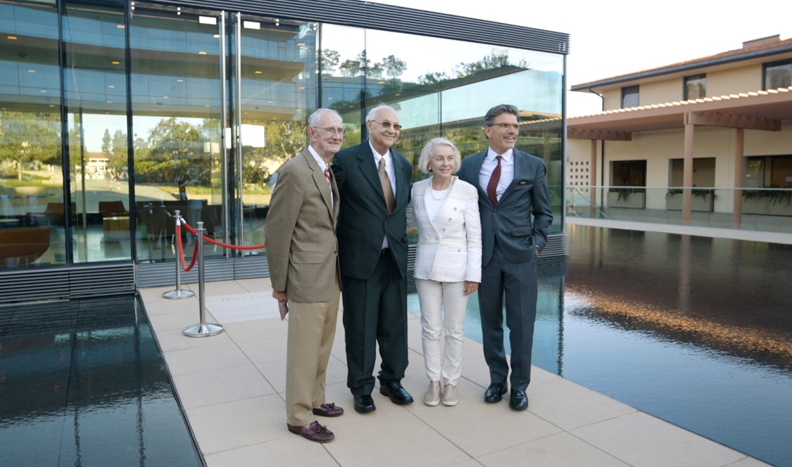 From left to right: former CMC president Jack Stark, Prof. Massoud, former CMC president Pamela Gann, and current president Hiram Chodosh stand on the walkway leading into the newly named Massoud building.