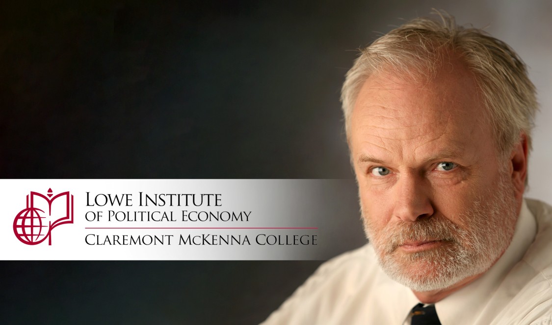 Manfred Keil, with Lowe Institute banner.