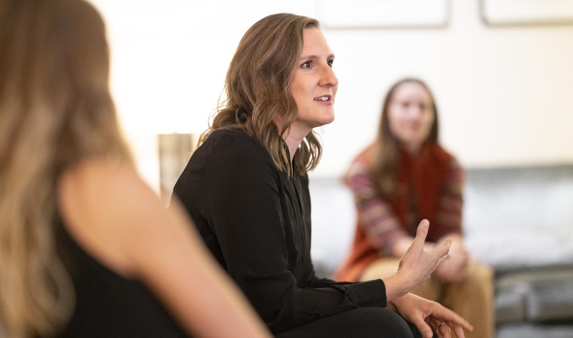 Helena B. Evich close-up talking with students