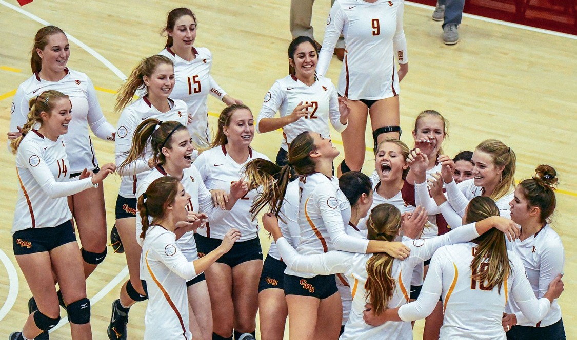 CMS volleyball team celebrates a victory