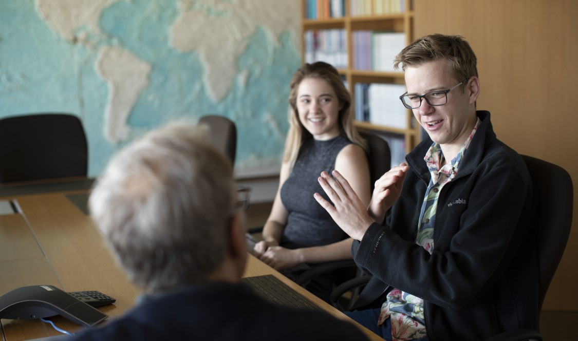 Students participating in a seminar on capitalism