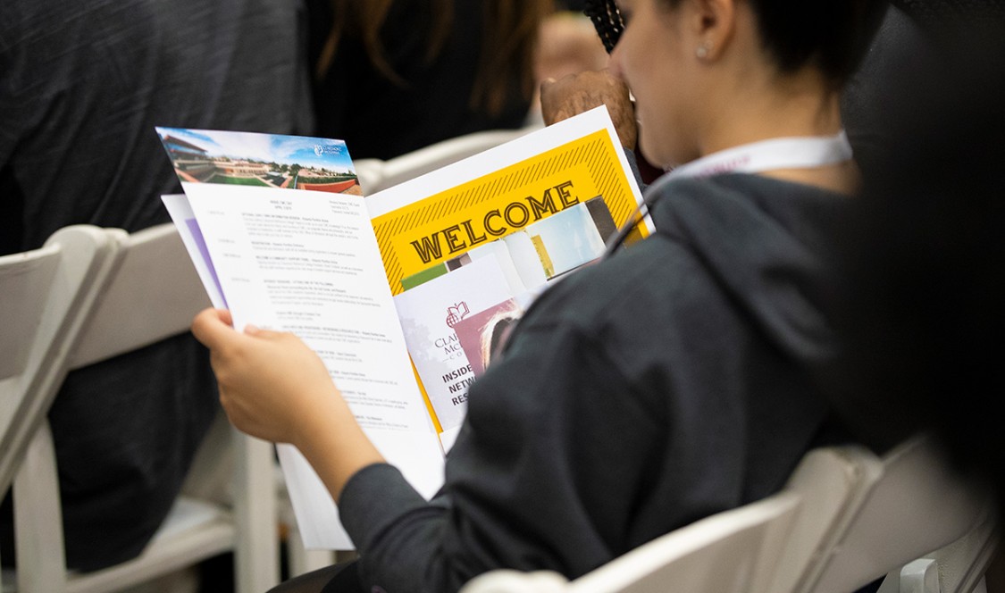 Student reviews a CMC welcome packet.