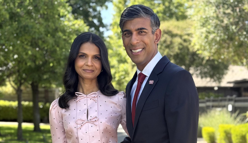 Rishi Sunak and Akshata Murty standing in garden