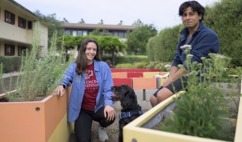Elmir Kouliev ’24 and Zoe Carlson ’22 in the garden near Beckett Hall