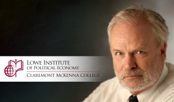 Manfred Keil, with Lowe Institute banner.