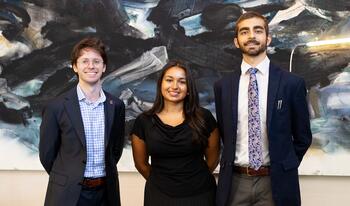 2026-27 Ath Fellows: Jasper Langley-Hawthorne ’27, Ambika (Bika) Gupta ’27, and Shivom Parihar ’28 standing in the Ath
