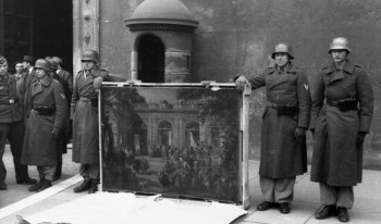 German soldiers of the Hermann Göring Division posing in front of Palazzo Venezia in Rome in 1944 with art  taken from the Biblioteca del Museo Nazionale di Napoli.