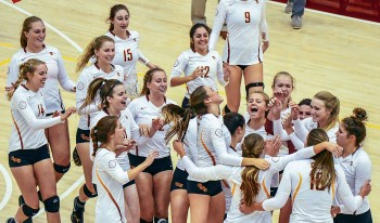CMS volleyball team celebrates a victory