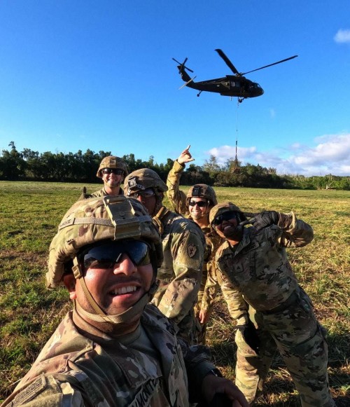 Selfie of Lindsay with her unit on grass field.