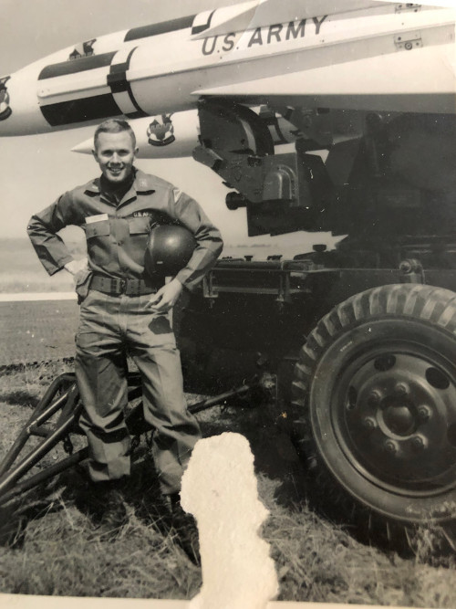Dave Forrest ’67 in front of an aircraft transport.