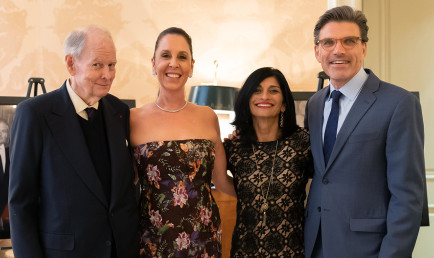 Robert Day (left) in a group photo with CMC's current President's wife, Priya Junnar, and President Hiram Chodosh, at an event.