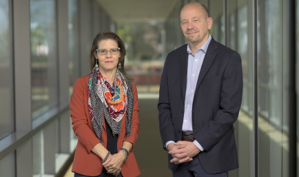 CMC Professors Heather Ferguson and Jon Shields in the hallway of Kravis Center.