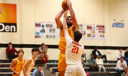 CMS Stag basketball player shooting the ball