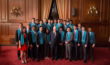 Robert Day Scholars from the Master’s Program in Finance Class of 2015 pose with Robert Day.