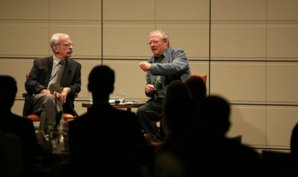 EUROPEAN CHALLENGES: Adam Michnik (right) discusses the political climate in Eastern Europe with a large Athenaeum audience  (pictured on left: translator Josef Sobelman).  Photo credit/William Vasta