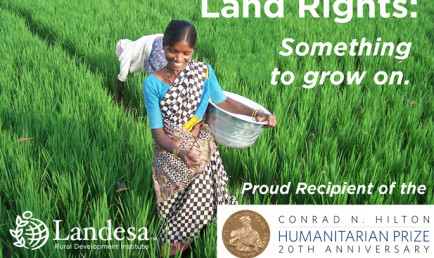 Woman tending land with Landesa support