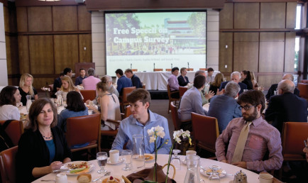 students and professors at the conference