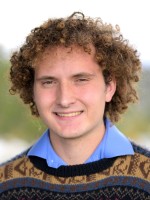 Quinten Carney, class of 2026 wearing brown sweater.