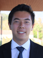 Nice smiling young man in business suit